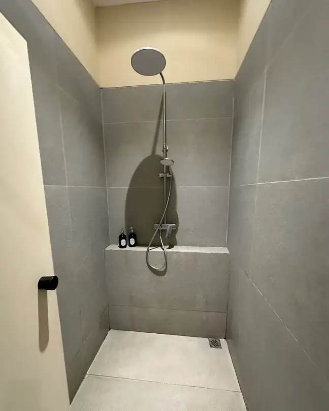 Grey-tiled rain shower